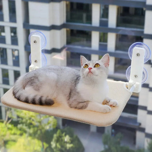 Foldable cat hammock with double suction cups for secure window placement.